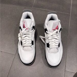 Jordan White Sneakers with Black Accents and Red Jumpman